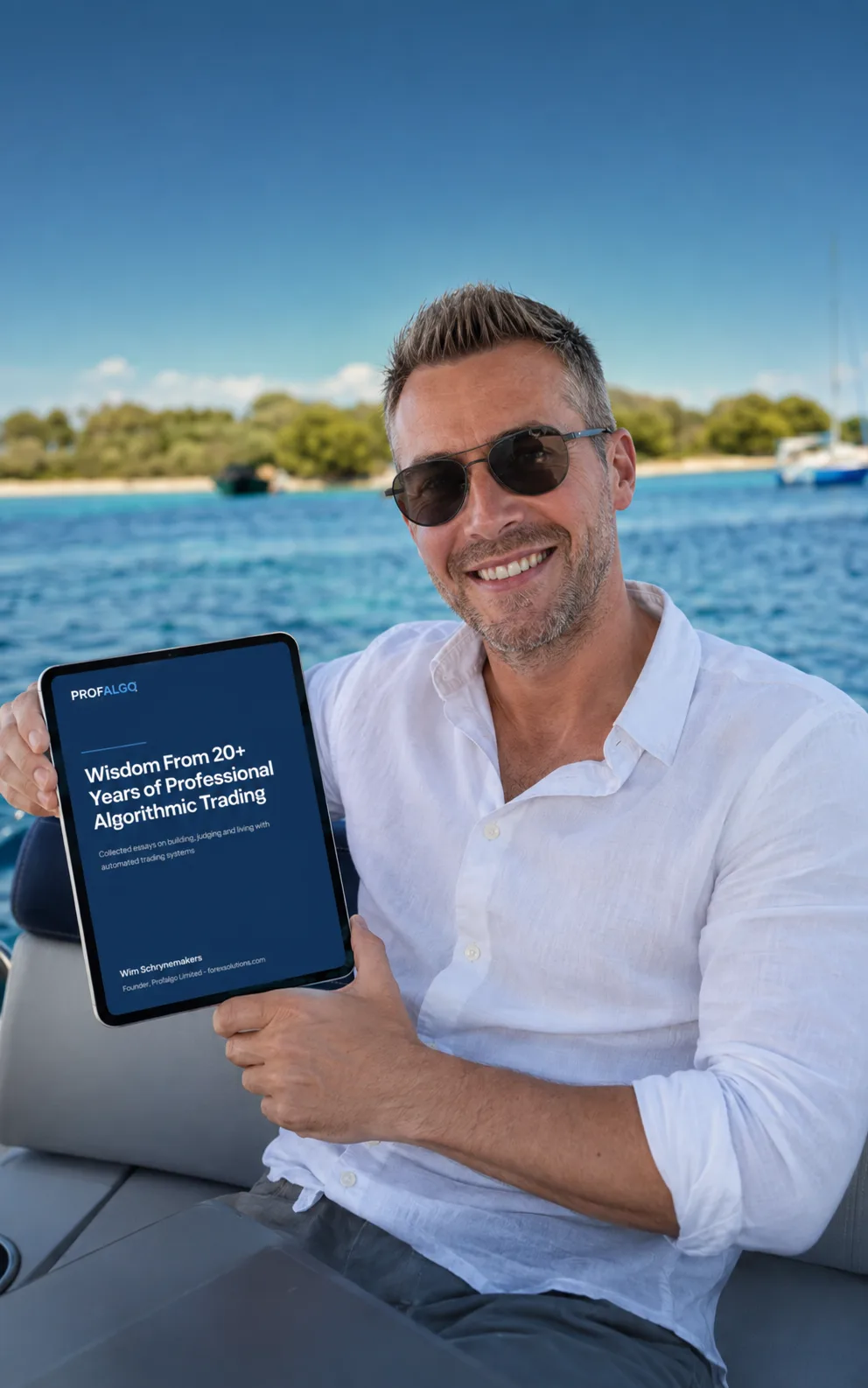 Wim Schrynemakers holding his book on algorithmic trading